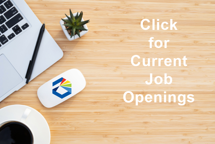 Desk with "Click Here for Current Job Openings" written on it.